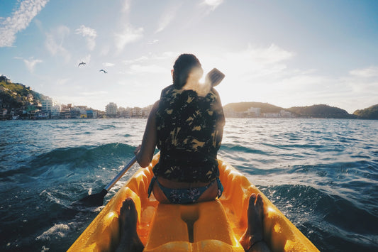 A person sitting on their kayak