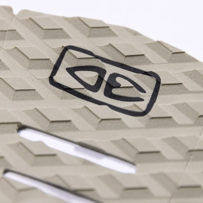 Beige surfboard tail pad with geometric pattern  and black logo on a white background